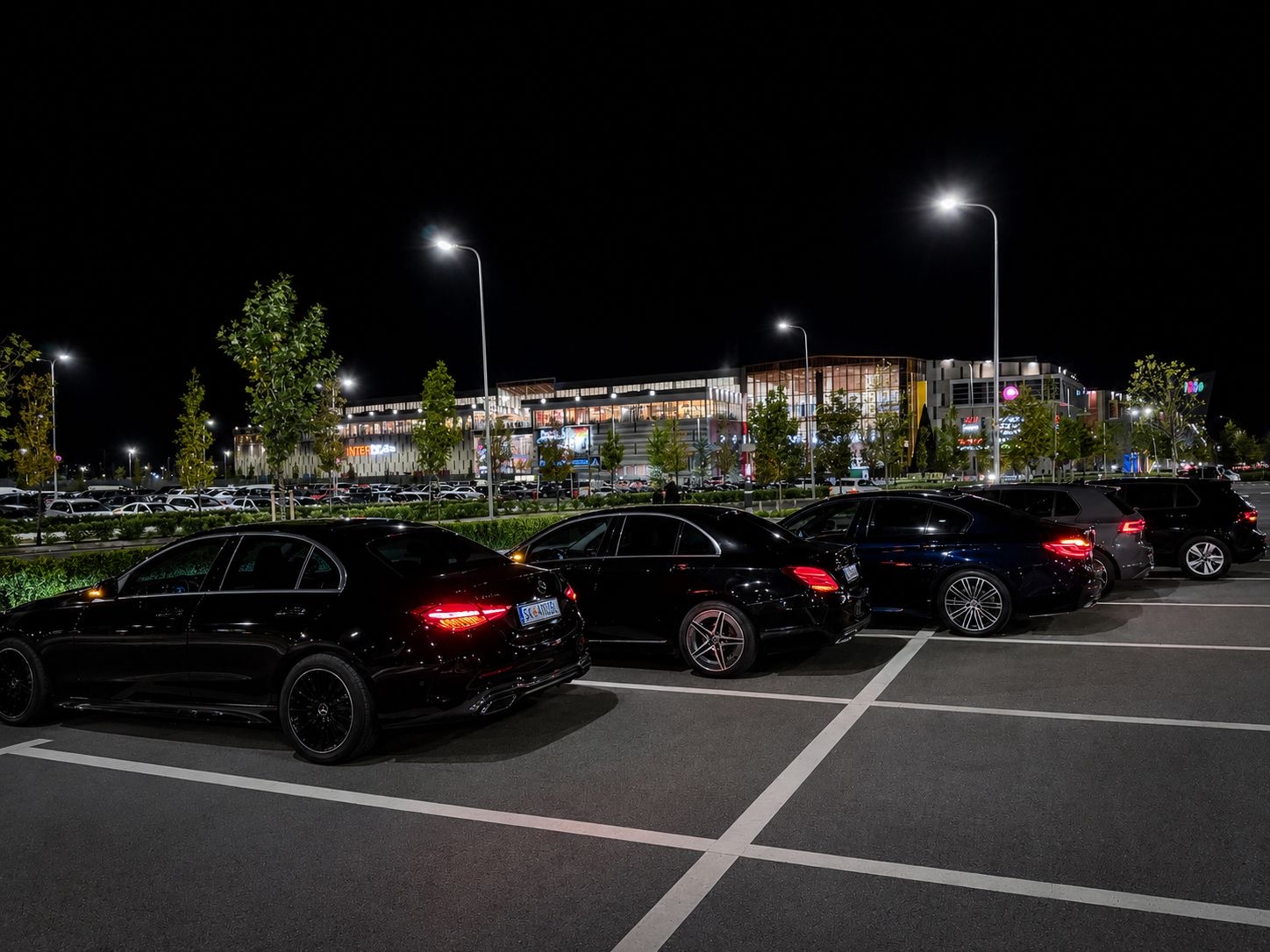 Pro Rent a Car sedans parked at night