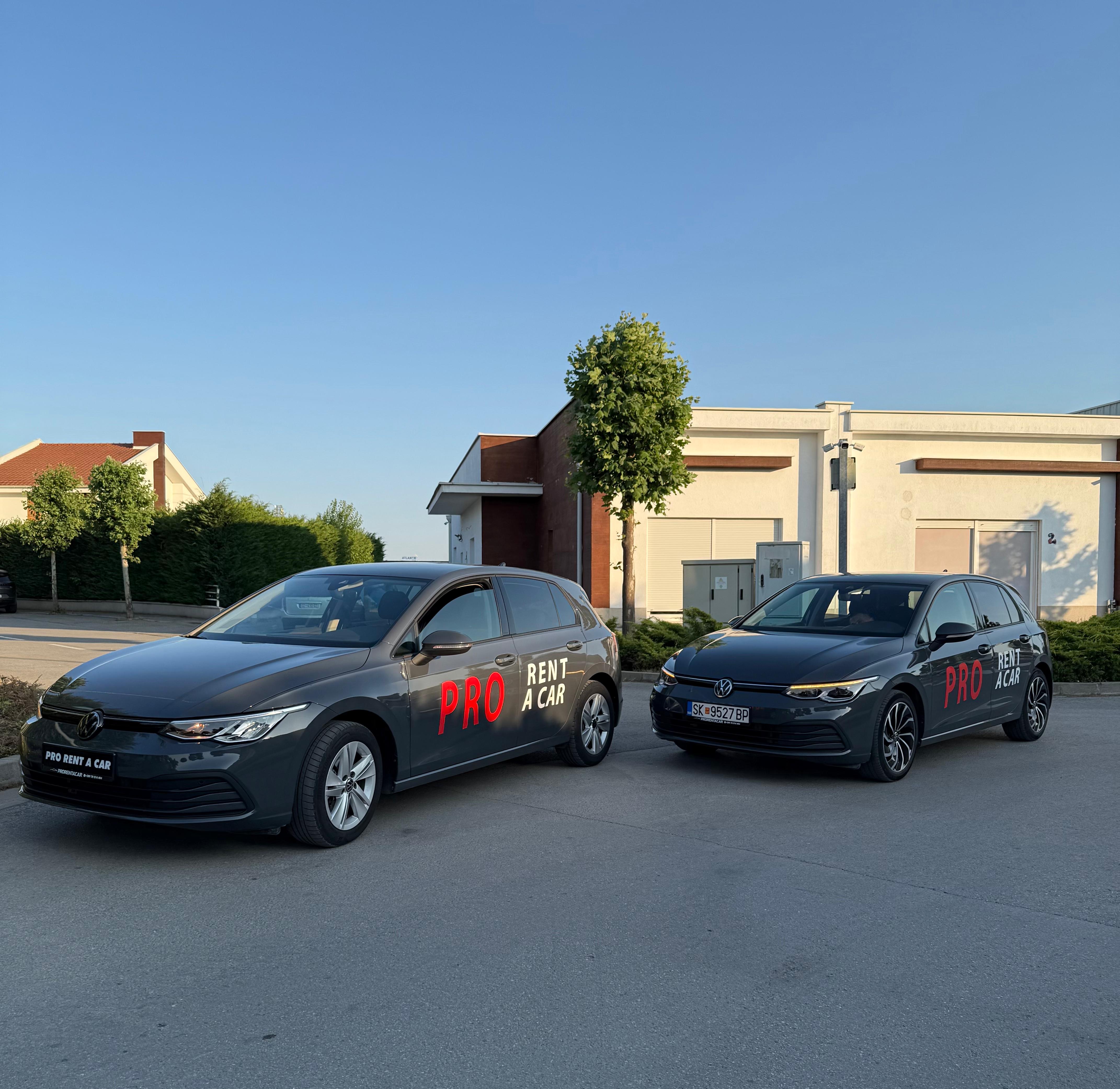 Two branded Pro Rent a Car Volkswagen Golf vehicles