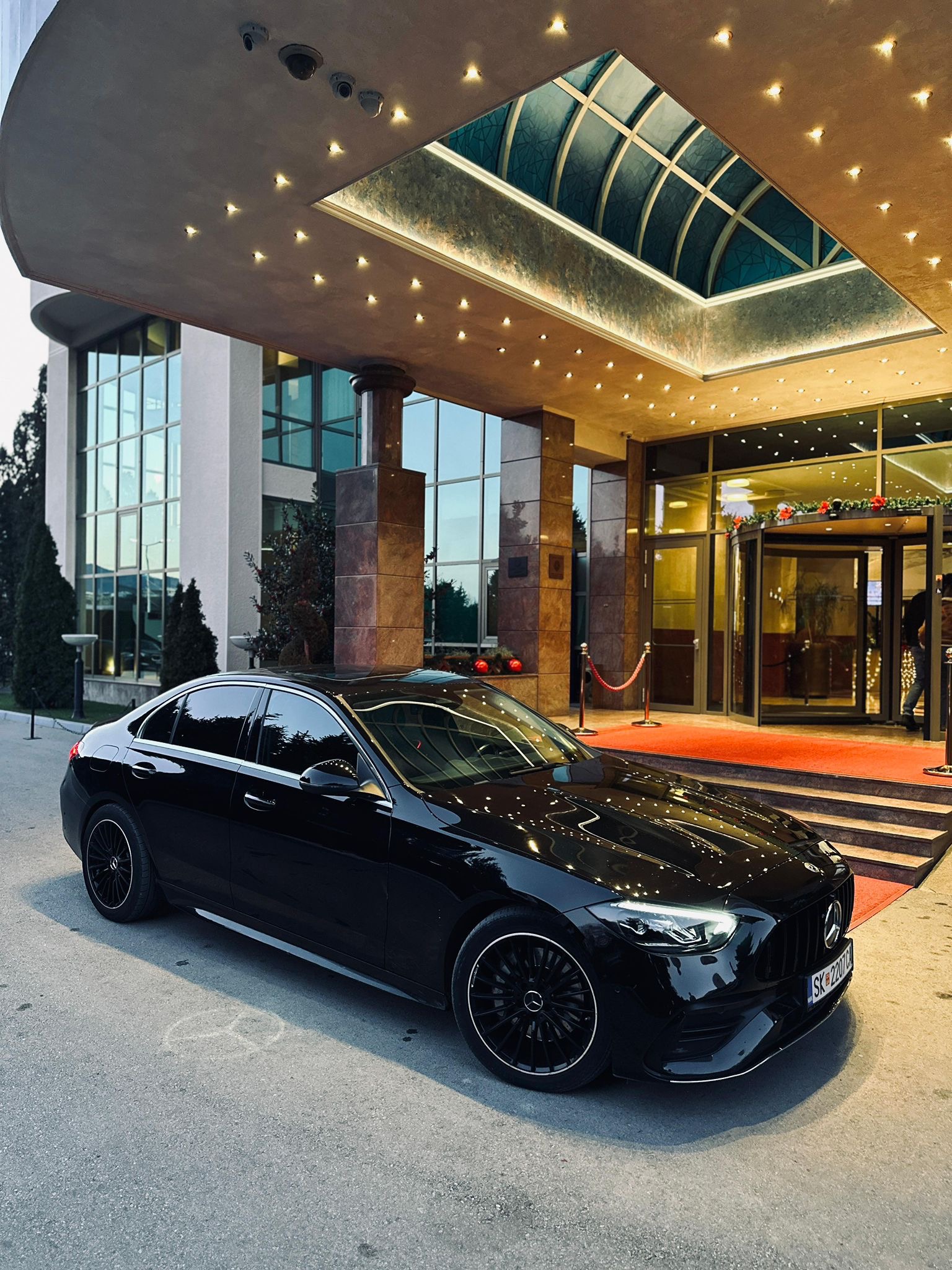 Pro Rent a Car Mercedes-Benz C-Class at a hotel entrance